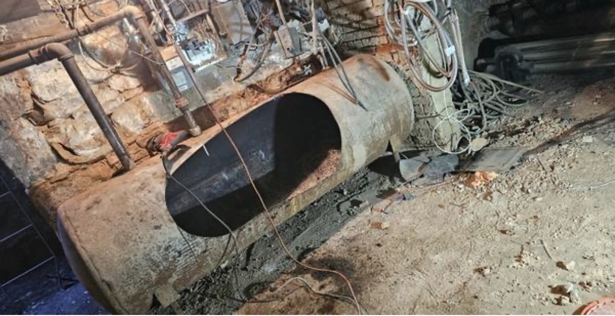 Cut metal oil tank in basement